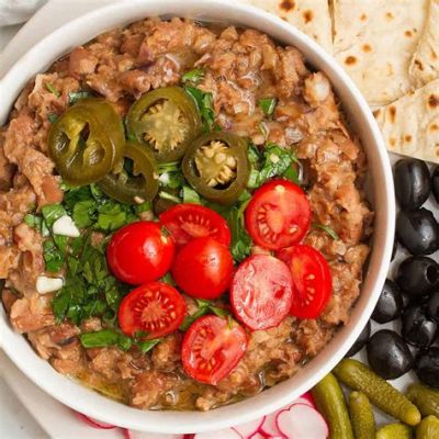  Ful Medames: Indulge in this Creamy Bean Delight and Experience a Symphony of Spiced Aromas!