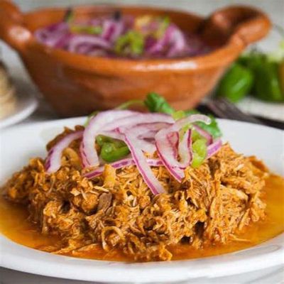  Cochinita Pibil: Tender Pulled Pork Stewed in Citrus and Achiote for a Fiery Fiesta in Your Mouth!